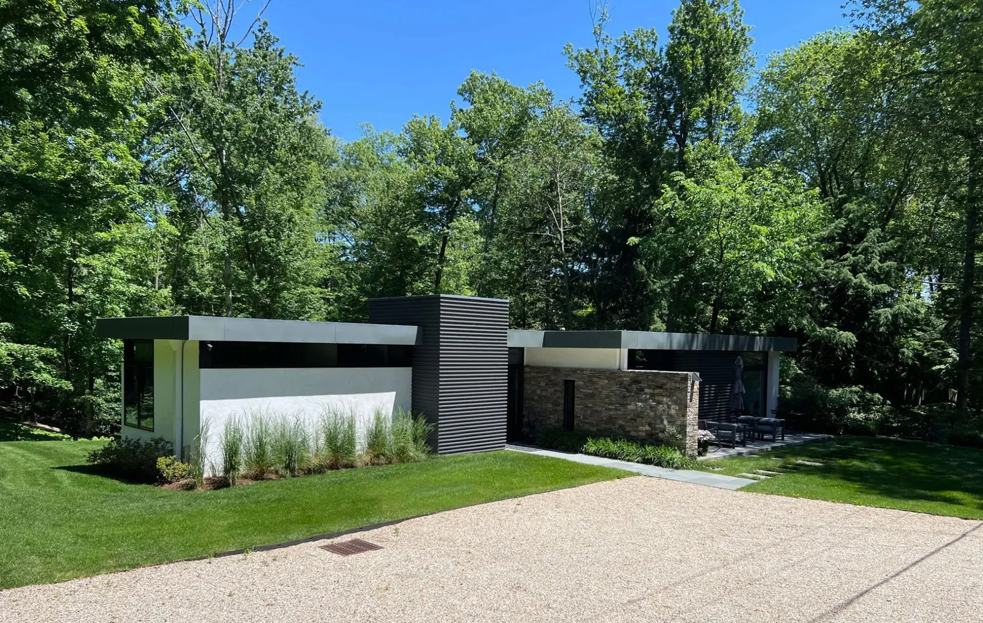 Modern low-profile home among trees